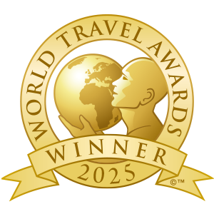 Award badge for American Cruise Lines, winner of North America's Leading Cruise Line 2025 by World Travel Awards.