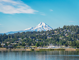 Hood River waterfront along the Columbia River with Mount Hood rising in the background.