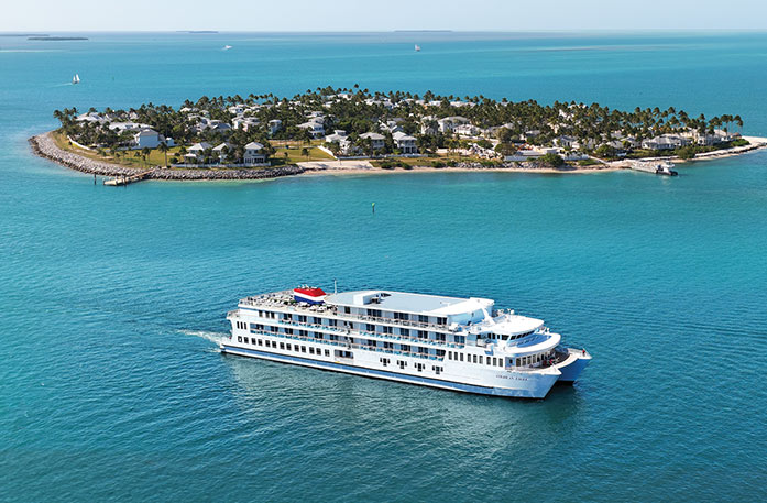 American Cruise Lines Coastal Cat sailing the coast of Florida with an island in the background
