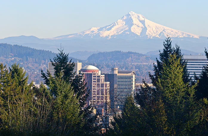 Downtown Portland skyline with Mount Hood in the background during a Columbia River cruise excursion.