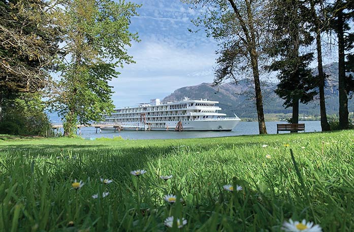 American Cruise Lines ship docked along the Columbia River during a Columbia and Snake Rivers cruise.
