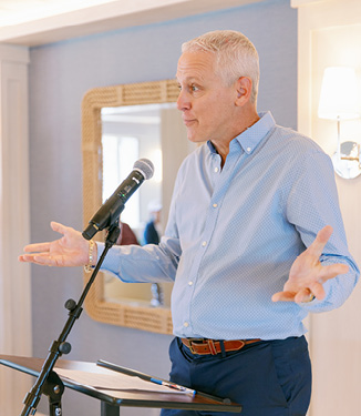 An onboard guest speaker informing American Cruise Lines guests about the history of the region.